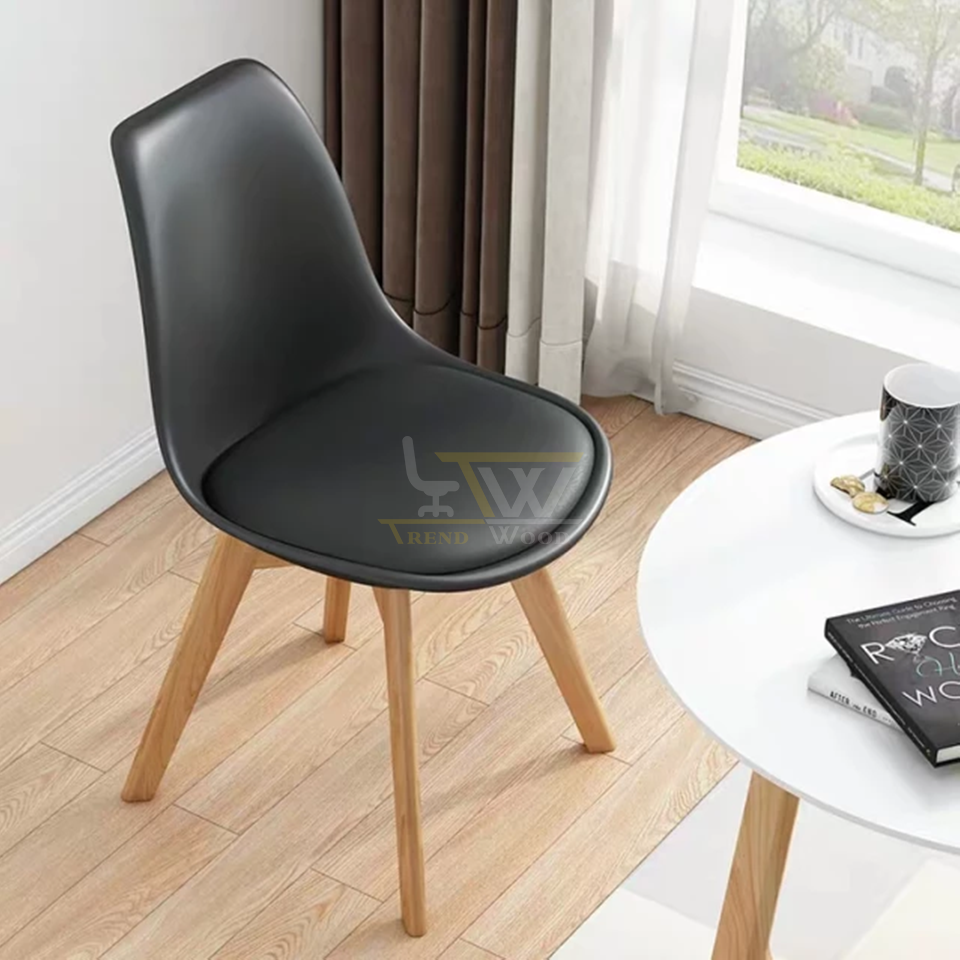 Black Molded Plastic Chair with Wood Legs and center table